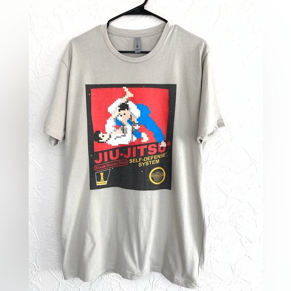 MENS NINTENDO JIU-JITSU RETRO VIDEO GAME COVER SHIRT SIZE LARGE NWOT - Picture 1 of 3
